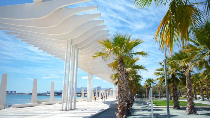 Malaga, white pergola and palm trees along the port promenade, Palmeral de las sorpresas